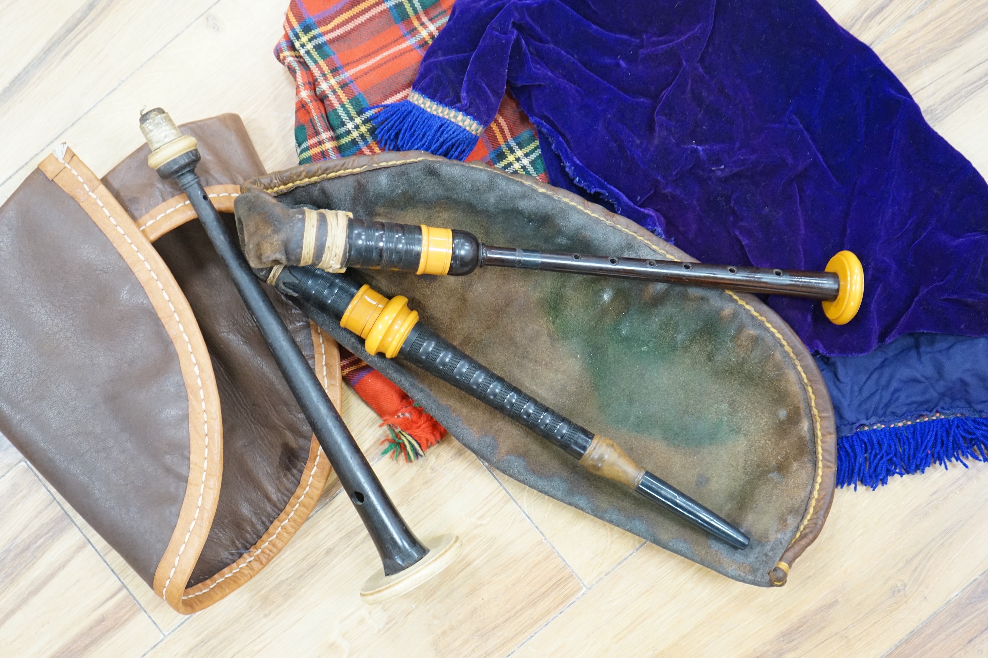 Two practice sets of bagpipes, one cased